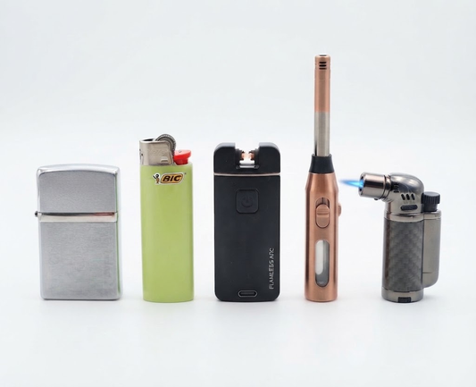 Five lighters of various styles; the torch lighter on the right is lit.